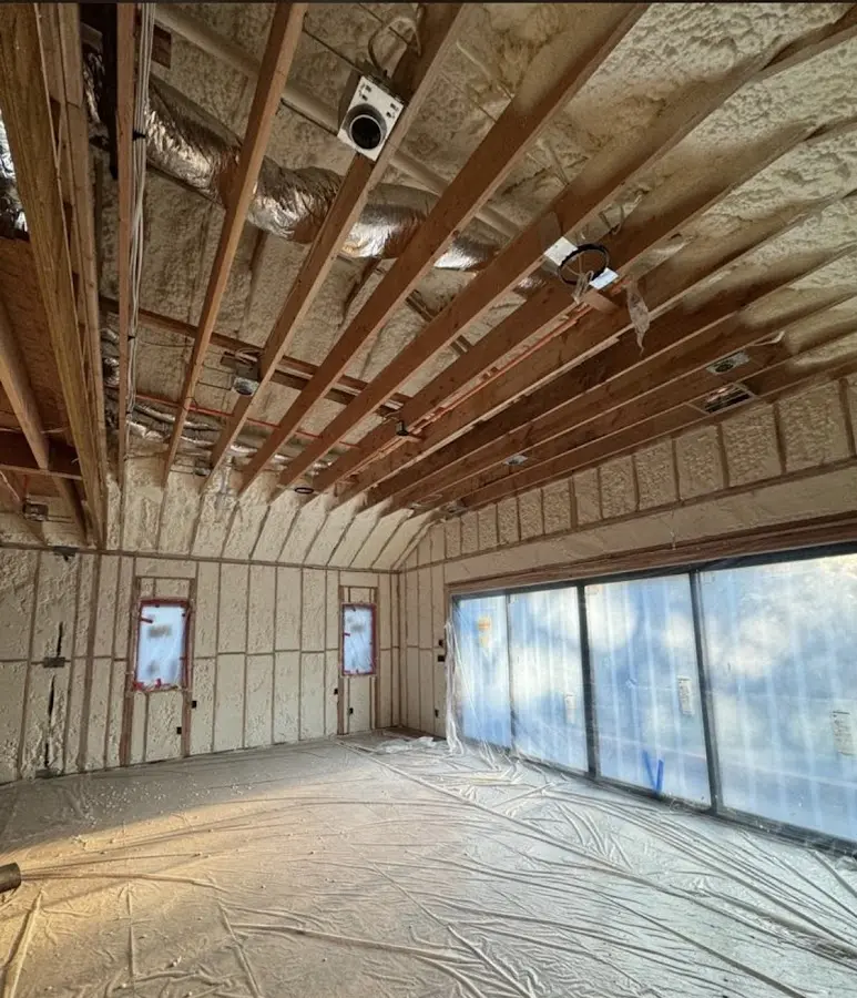 Interior walls and ceiling insulated with spray foam during new construction in Chatham